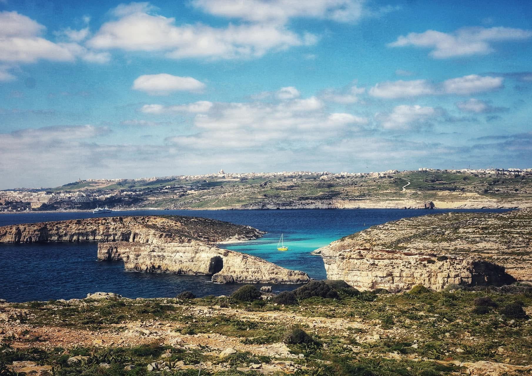 Comino cliffs and turquoise lagoon from above — Malta